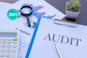 Document labeled AUDIT with a magnifying glass, charts, and calculator.