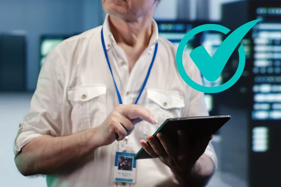Man in white shirt uses a tablet, with a green checkmark indicating successful operation.