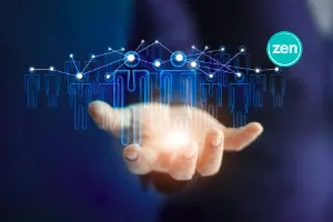 A hand supports a glowing digital network of interconnected human figures and the Zen logo.