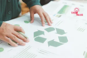 Hands interact with a large green recycling symbol on a white document.