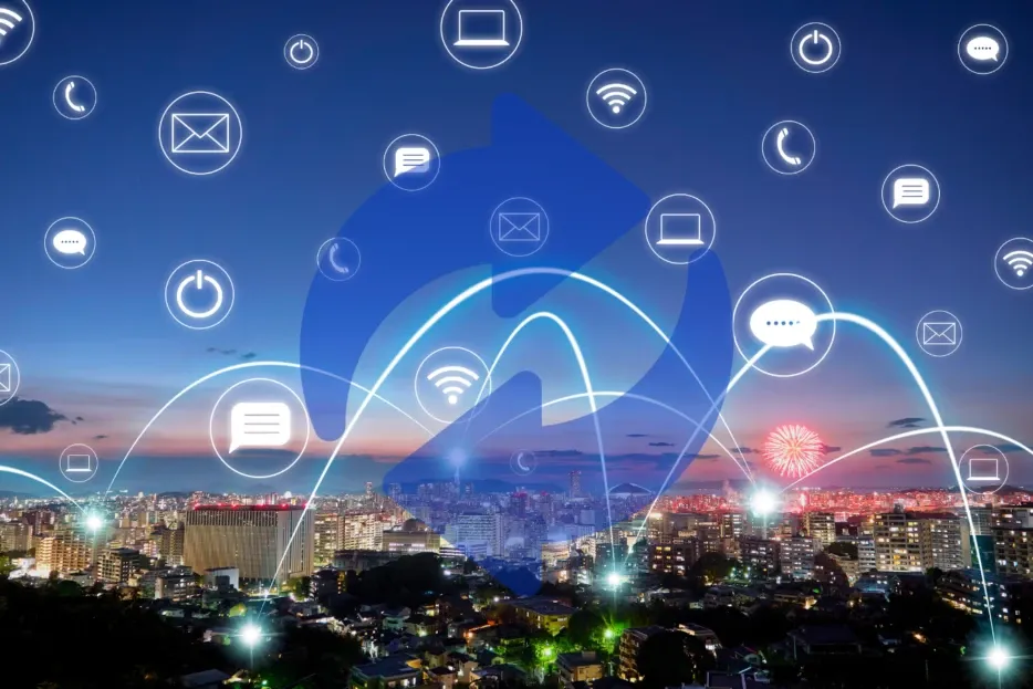 Digital network overlayed on a glowing city skyline with various communication icons.