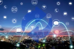 City skyline at night with technology icons and glowing network connections overhead.